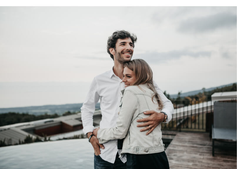 Husband and wife hug each other