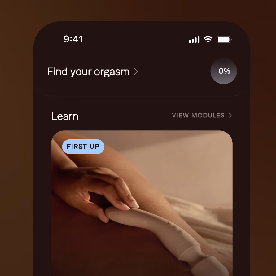 Smartphone screen showing an app interface with a section titled 'Find your orgasm' and progress at 0%. Below, a 'Learn' module preview with an image of a hand holding a white curved device against skin labeled 'FIRST UP'.