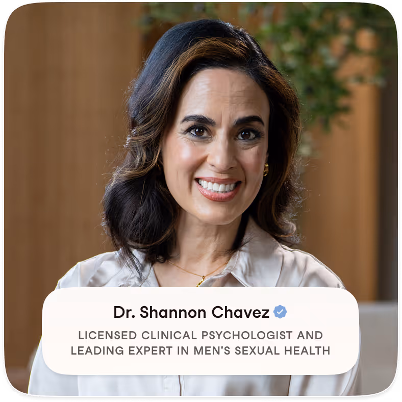 Smiling woman with dark wavy hair and light blouse in an indoor setting, identified as Dr. Shannon Chavez, licensed clinical psychologist and expert in men's sexual health.